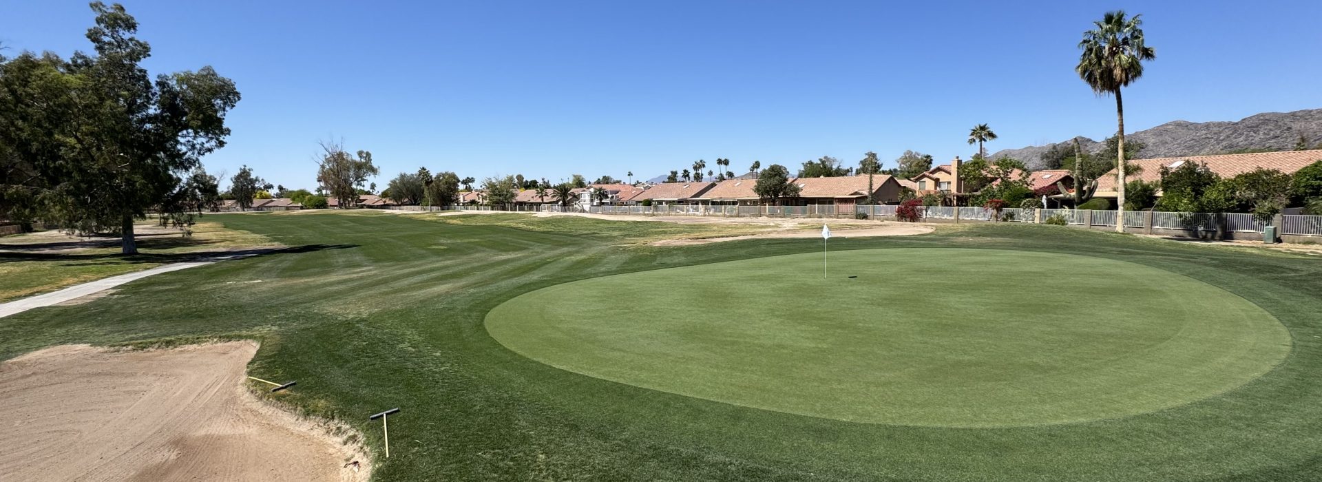 Golf course green with bunker